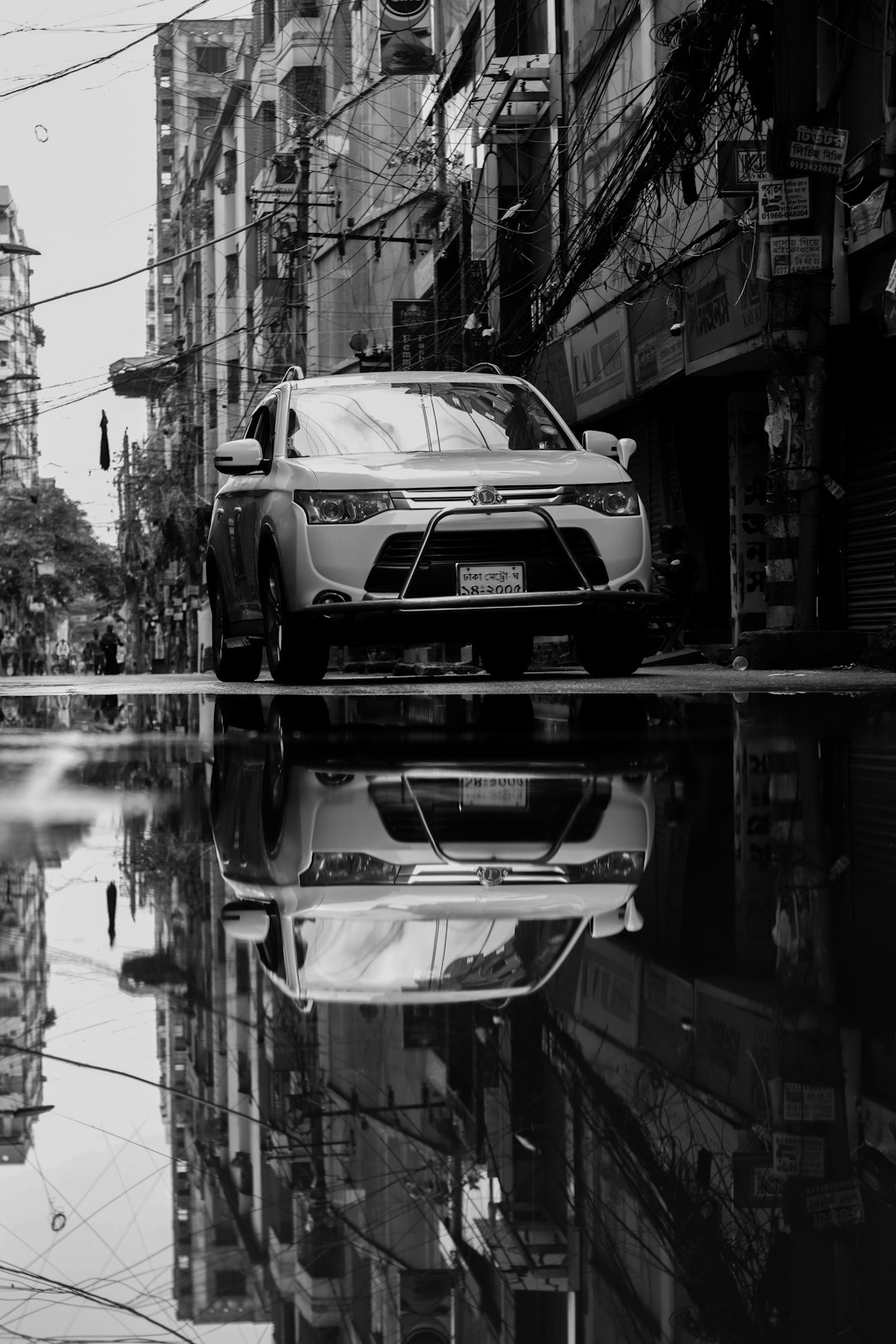 a-car-parked-on-the-side-of-a-street-k01tuxn4ot4